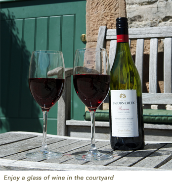 Enjoy a glass of wine in the courtyard